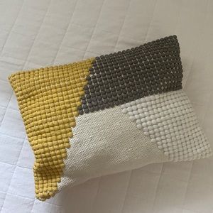 Target throw pillow in yellow, grey, and white